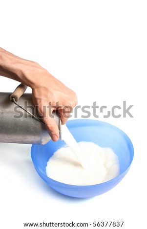 pouring milk into a bowl