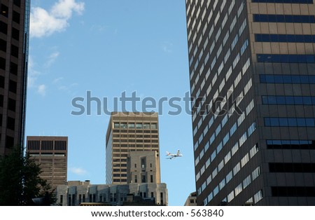 passengers airplane behind skylines in city of Boston, Mass