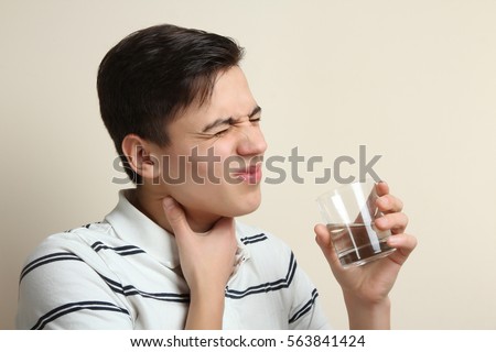 Men have a sore throat. Sick. Royalty-Free Stock Photo #563841424