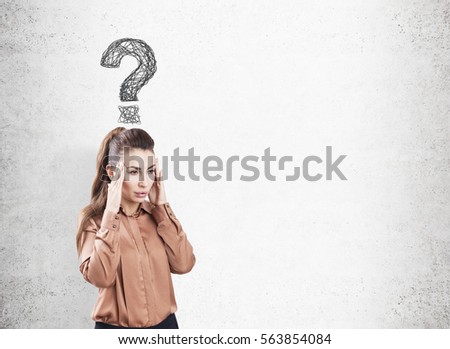 Portrait of a stressed woman wearing a brown blouse. She is standing near a concrete wall. There is a gray question mark above her head. Mock up.
