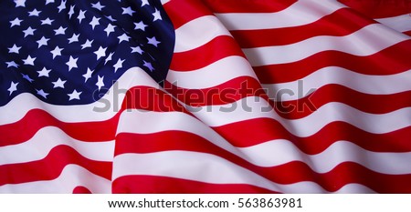 Beautifully waving star and striped American flag Royalty-Free Stock Photo #563863981