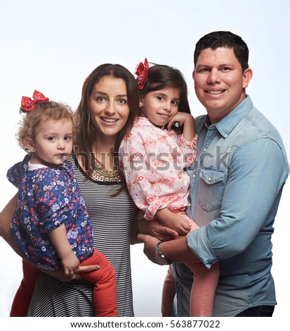 Cute young family of four with small girls kids isolated on white background