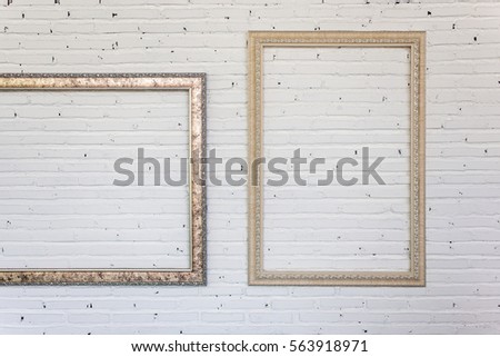 vintage frames on white brick wall. background.