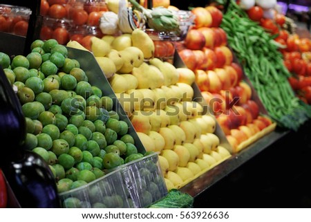 Fresh fruits and vegetables in market Royalty-Free Stock Photo #563926636