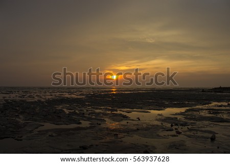 Sunset at beach sekinchan perak malaysia with rubbish on beach 