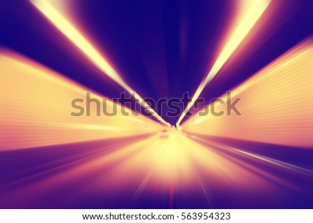 Abstract image of speed motion in tunnel at night. Royalty-Free Stock Photo #563954323