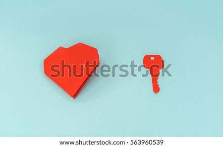 Paper cut of Key for heart as a symbol of love