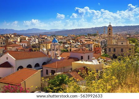 Top view of the city of Chania. Greece, island Crete. City landscape. Small city view. Tiled roofs against the sky with clouds.