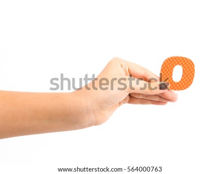 Hand holding number zero isolated on a white background