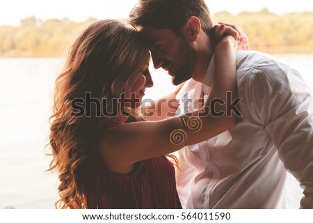 Happy couple face to face and Valentine's Day Royalty-Free Stock Photo #564011590