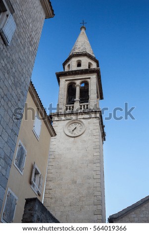 Old stone tower on the background of blue sky
