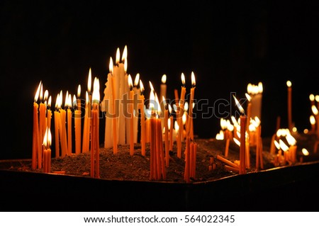 candles in church . geghard monastery Armenia