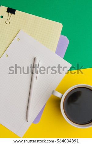 notebook, pen, coffee on colorful background, business concept