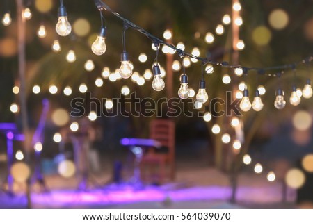 Hanging decorative lights for a wedding party