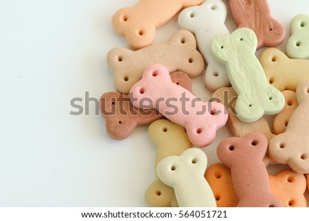 Delicious of dog biscuit , dog snack or dog  chew copy space on the white background, Can use background , Advertising for pet food. Royalty-Free Stock Photo #564051721