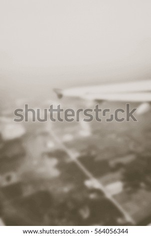 Blurred  background abstract and can be illustration to article of Clouds and sky as seen through window of an aircraft