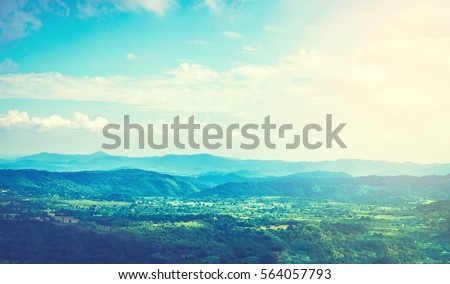 Amazing picture of green mountain landscape with blue sky and white clouds. Great nature scenery of green mountain range under sunlight at the middle of summer day