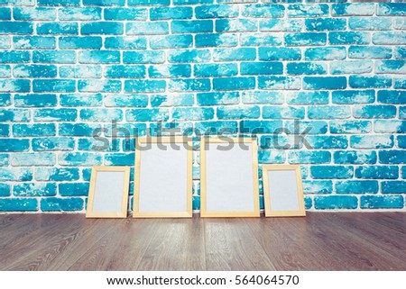 Picture frame on brick wall