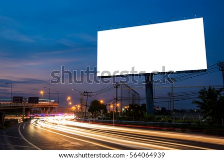 Blank billboard for advertisement at twilight time with light trails on the road at dusk, business advertising concept.   