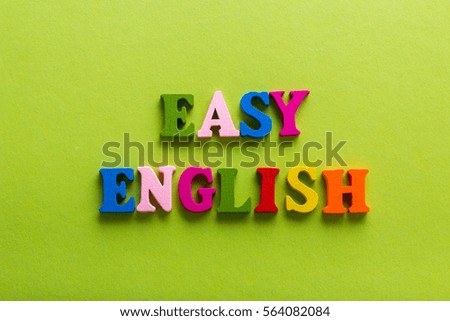 Word of English of color wooden letters of the alphabet on a blue background