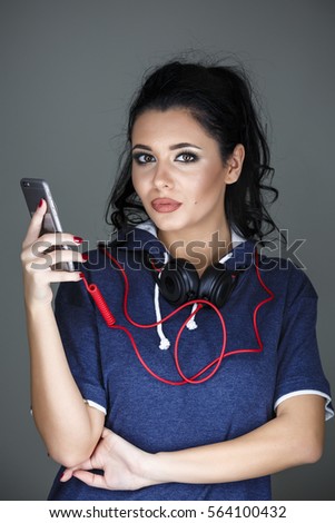 portrait beautiful brunette woman posing with headphones