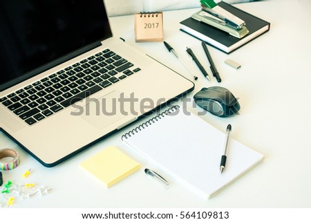 Office table desk workspace with laptop notebook pc stick notes on white background. Template mock up with copy space for text. Freelancer cozy working place area. Working at home or online concept. 