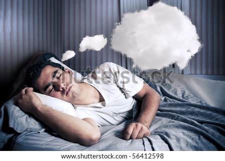 Man comfortably sleeping in his bed at night Royalty-Free Stock Photo #56412598