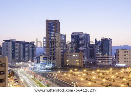 View of Fujairah City at dusk. United Arab Emirates, Middle East Royalty-Free Stock Photo #564128239