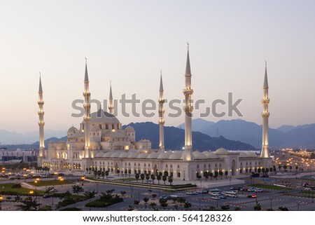 The new Sheikh Zayed Grand Mosque in Fujairah illuminated at night. United Arab Emirates, Middle East Royalty-Free Stock Photo #564128326