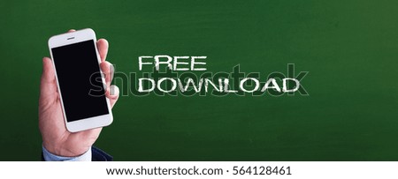 Smart phone in hand front of blackboard and written FREE DOWNLOAD