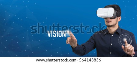 Future Technology and Business Concept: The Man with Glasses of Virtual Reality and touching VISION button