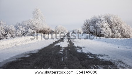 Snowy road in the winter. Royalty-Free Stock Photo #564149080