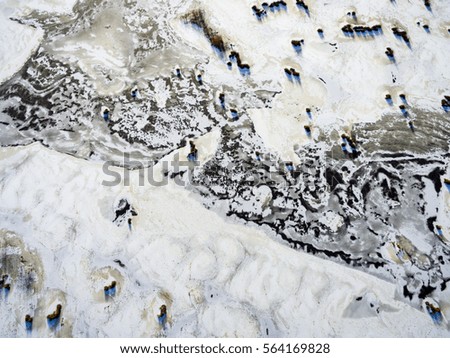 aerial view of frozen forest lake in winter. drone photography. abstract texture