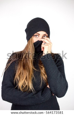 Young Woman with Black Sweater and Snow Hat.