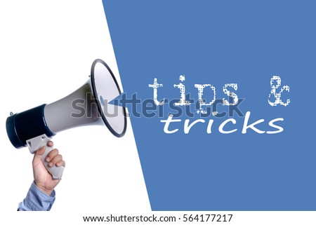 Tips & Tricks. Hand with megaphone / loudspeaker. Business concept.
