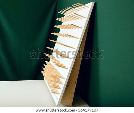 photo of stand for  threads isolated on green background