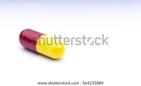 Closeup of Medication capsules pill on white background. Selective focus.
