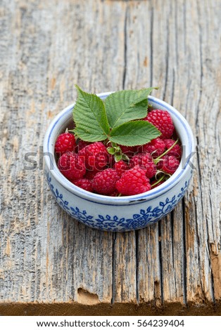 raspberry on wooden surface
