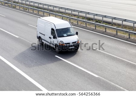 White Delivery Van On Highway
