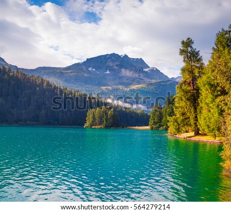 Sunny summer morning on Silvaplana lake. Great outdoor scene in Swiss Alps, Sondrio province Lombardy region, Italy, Europe. Artistic style post processed photo.