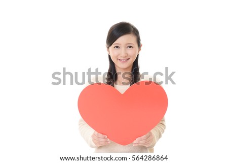 Smiling woman with a red heart