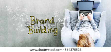 Brand Building text with man using a laptop