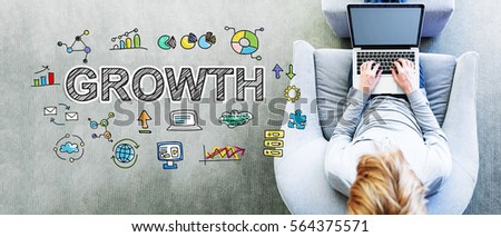 Growth text with man using a laptop