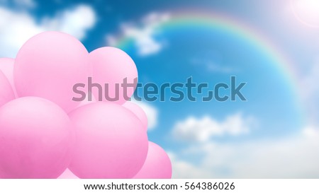 Beautiful image of sweet pastel pink balloons bunch against blur background of blue sky, white clouds and rainbow with sunlight in summer season.Concept of wedding honeymoon party or valentine day.