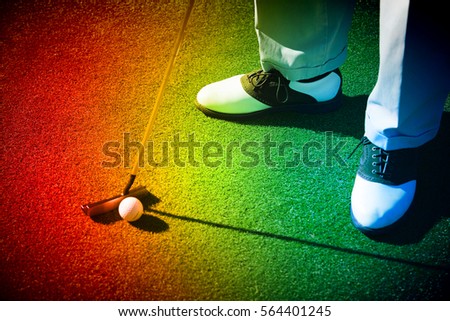 Person Putting Golf Ball