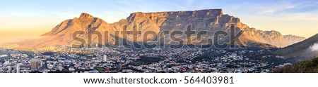 Panoramic view of Table Mountain in Cape Town, South Africa at sunset Royalty-Free Stock Photo #564403981