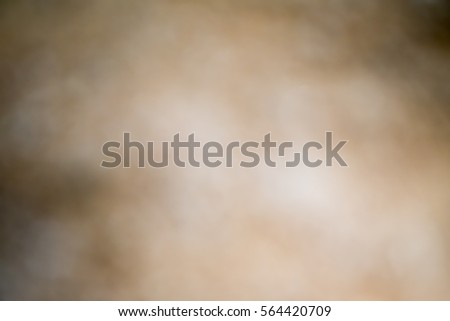 Light golden brown abstract background with radial gradient effect