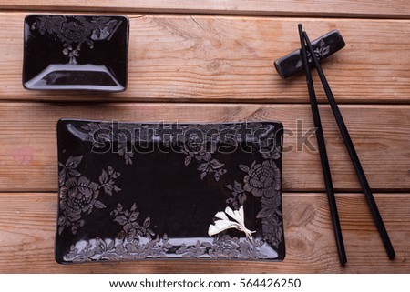 black square sushi set on wooden background