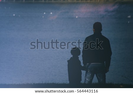 Father and son silhouette Royalty-Free Stock Photo #564443116
