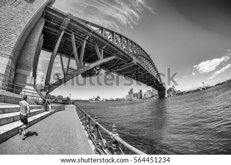 Black and white view of Sydney Harbour Bridge.